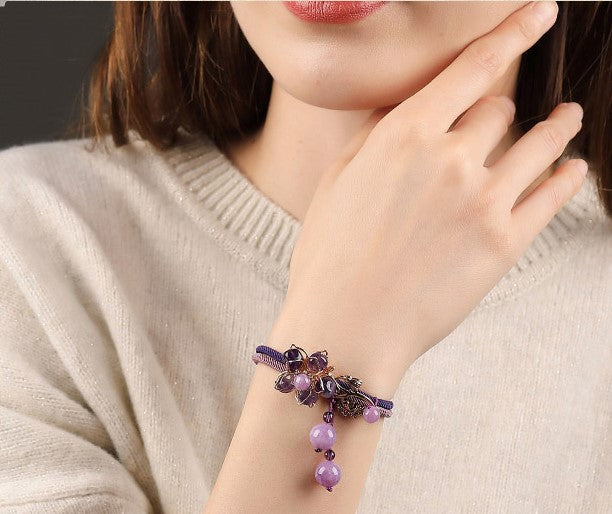 Charming Perfections Purple Amethyst Crystal Natural Stone Flower Bracelet Jewelry trimmed in Gold on wrist with white sweater background for Gift, Birthday, Anniversary, Wedding, Black Friday, Christmas Friendship and Holiday