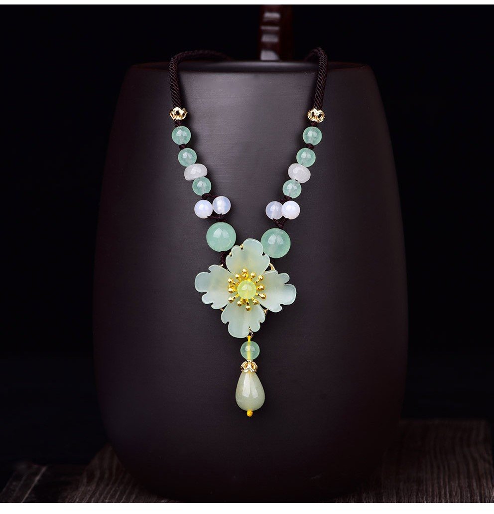 Charming Perfections High Quality Natural Green Jade Flower necklace Jewelry with wooden vase background Pure Natural Stone Crystal Beauty Jewelry. Perfect for Birthday Gifts, Anniversary, Black Friday, Christmas, or any Occasion. Perfect Present for a Loved one. Fashion and Style. Very Fashionable for that special someone.