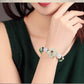 Charming Perfections High Quality Natural Green Agate flower bracelet Jewelry on wrist with grey background Pure Natural Stone Crystal Beauty Jewelry. Perfect for Birthday Gifts, Anniversary, Black Friday, Christmas, or any Occasion. Perfect Present for a Loved one. Fashion and Style. Very Fashionable for that special someone.