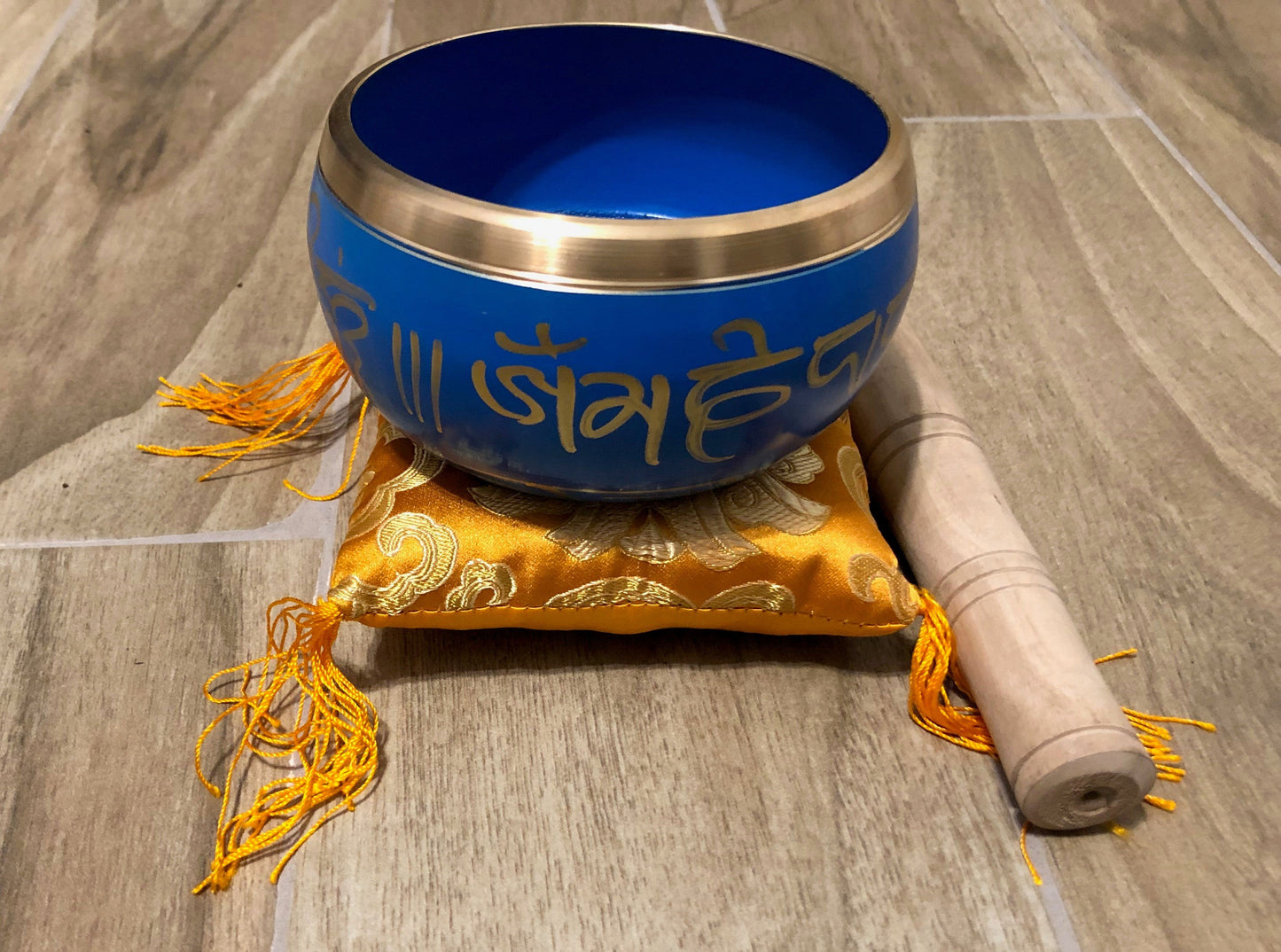 Charming Perfection Blue Tibetan Buddha Embossed Chakra Signing Bowl with mallet and cushion on Wood tile background for Gift, Birthday, Anniversary, Wedding, Christmas Friendship and Holiday