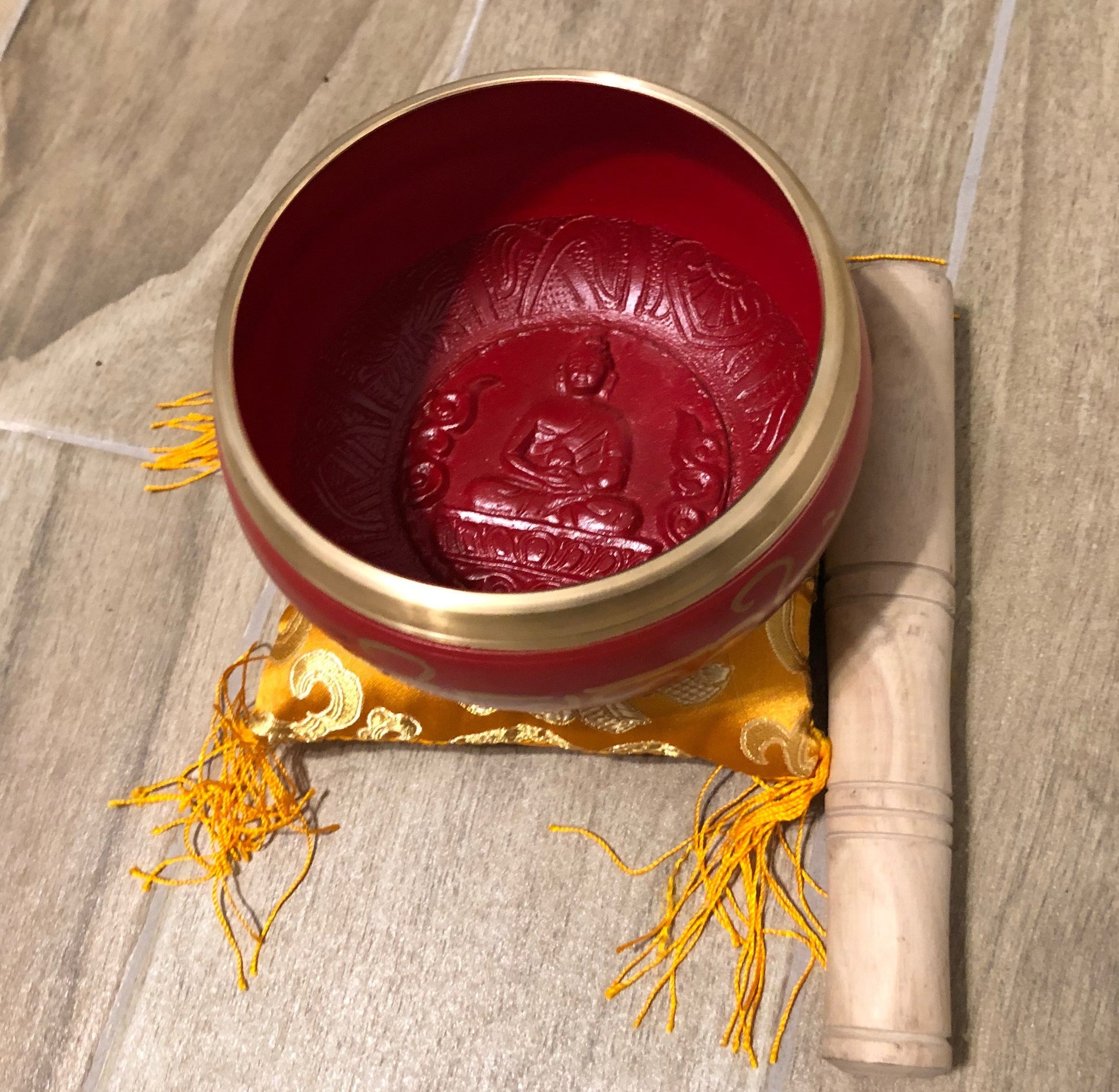 Charming Perfection Red Tibetan Buddha Embossed Chakra Signing Bowl with mallet and cushion on Wood tile background for Gift, Birthday, Anniversary, Wedding, Christmas Friendship and Holiday