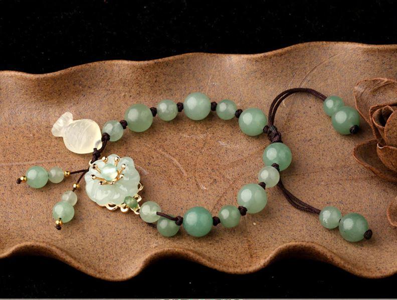 Charming Perfections High Quality Natural Green Jade flower fish bracelet Jewelry on brown leaf art with brown background Pure Natural Stone Crystal Beauty Jewelry. Perfect for Birthday Gifts, Anniversary, Black Friday, Christmas, or any Occasion. Perfect Present for a Loved one. Fashion and Style. Very Fashionable for that special someone.