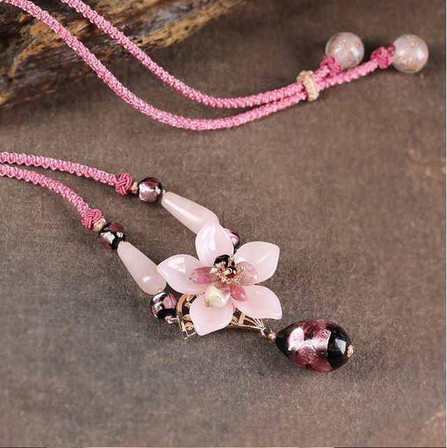 Charming Perfections Elegant Pink Tourmaline Crystal Natural Stone Flower Necklace Jewelry on wood art with brown background for Gift, Birthday, Anniversary, Wedding, Black Friday, Christmas, Friendship and Holiday