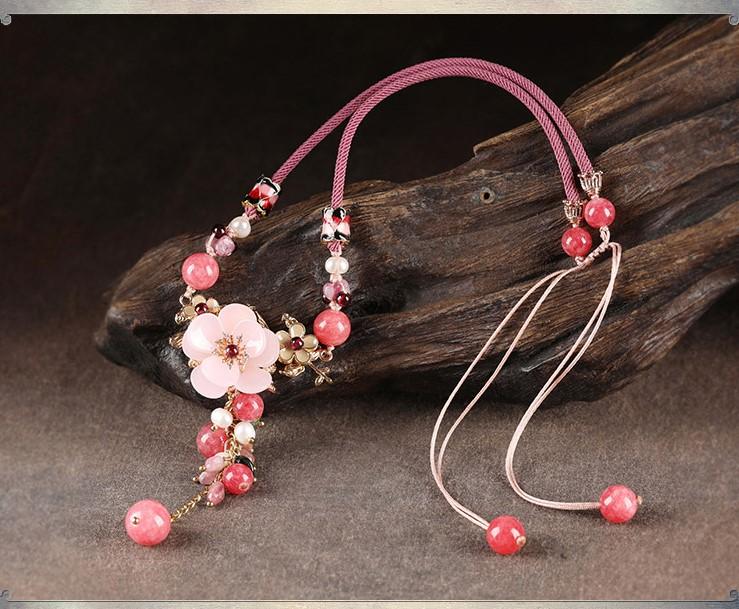 Charming Perfections Elegant Pink Tourmaline Crystal Natural Stone Flower Necklace Jewelry on wood art with brown background for Gift, Birthday, Anniversary, Wedding, Black Friday, Christmas, Friendship and Holiday