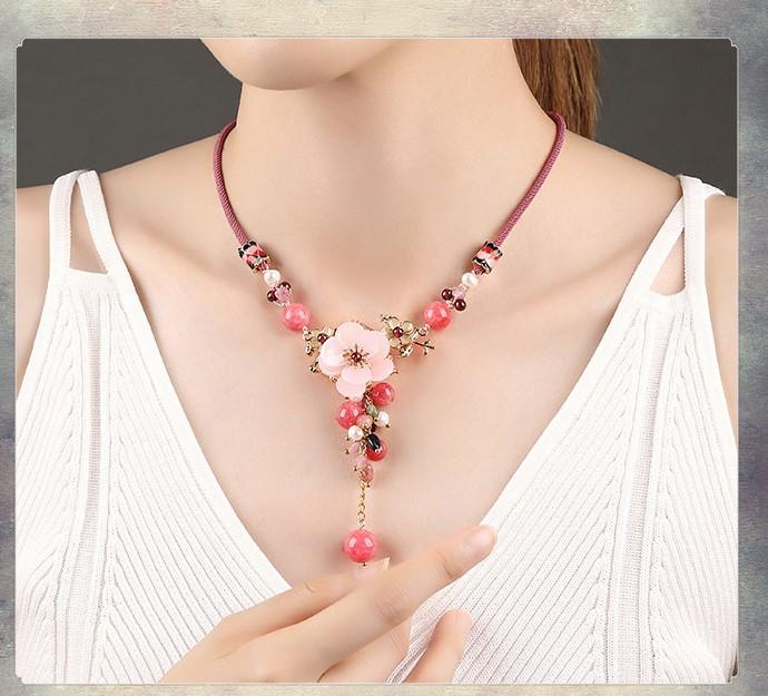 Charming Perfections Elegant Pink Tourmaline Crystal Natural Stone Flower Necklace Jewelry around neck with brown background for Gift, Birthday, Anniversary, Wedding, Black Friday, Christmas, Friendship and Holiday