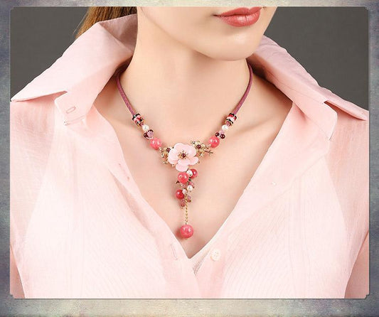 Charming Perfections Elegant Pink Tourmaline Crystal Natural Stone Flower Necklace Jewelry around neck with brown background for Gift, Birthday, Anniversary, Wedding, Black Friday, Christmas, Friendship and Holiday