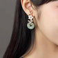 Charming Perfections Chakra Green Jade Earrings with shell flower 18kGP over Sterling Silver hanging from Ear. Perfect for Birthday Gifts, Anniversary, Black Friday, Christmas, or any Occasion. Perfect Present for a Loved one. Fashion and Style. Very Fashionable for that special someone.