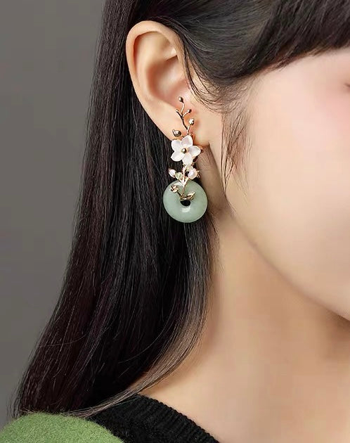 Charming Perfections Chakra Green Jade Earrings with shell flower 18kGP over Sterling Silver hanging from Ear. Perfect for Birthday Gifts, Anniversary, Black Friday, Christmas, or any Occasion. Perfect Present for a Loved one. Fashion and Style. Very Fashionable for that special someone.