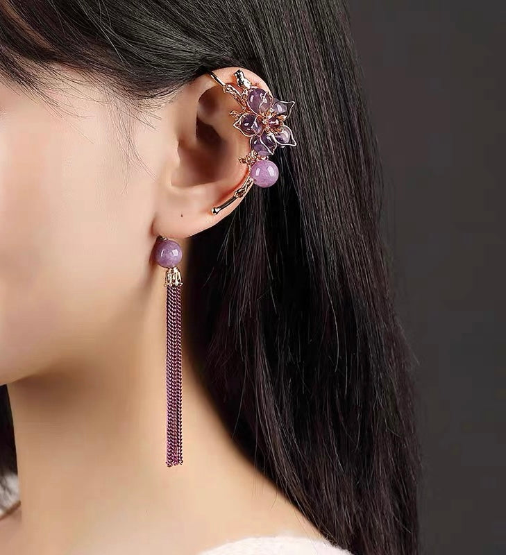 Charming Perfections Trendy One Ear Purple Amethyst Flower Earring Jewelry on ear with grey background Pure Natural Stone Crystal Beauty Jewelry. Perfect for Birthday Gifts, Anniversary, Black Friday, Christmas, or any Occasion. Perfect Present for a Loved one. Fashion and Style. Very Fashionable for that special someone.