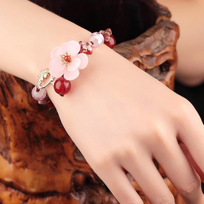 Charming Perfections High Quality Natural Luxury Pink Tourmaline flower bracelet Jewelry on wrist with wooden art background Pure Natural Stone Crystal Beauty Jewelry. Perfect for Birthday Gifts, Anniversary, Black Friday, Christmas, or any Occasion. Perfect Present for a Loved one. Fashion and Style. Very Fashionable for that special someone.