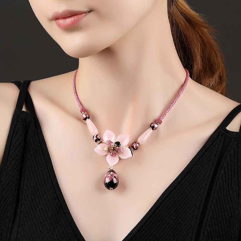 Charming Perfections Elegant Pink Tourmaline Crystal Natural Stone Flower Necklace Jewelry around neck with brown background for Gift, Birthday, Anniversary, Wedding, Black Friday, Christmas, Friendship and Holiday